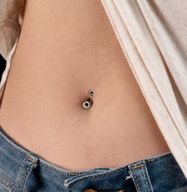 silver belly button piercing
