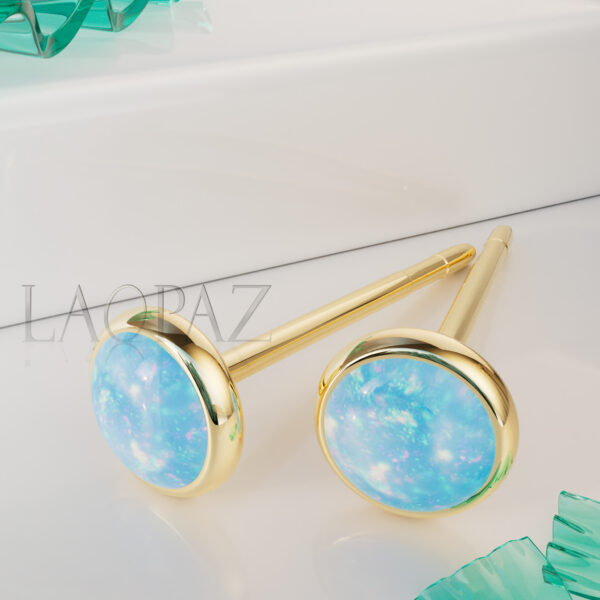 gold ear studs with blue opal